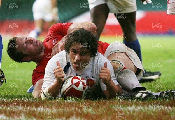 26.08.07  Wales v France... France's Sebastien Bruno scores try despite tackle by Ian Gough 