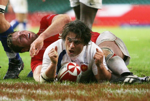 26.08.07  Wales v France... France's Sebastien Bruno scores try despite tackle by Ian Gough 