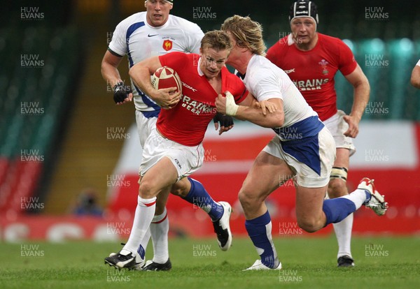 26.08.07 - Wales v France -  Wales' Dwayne Peel is tackled by France's Remy Martin 