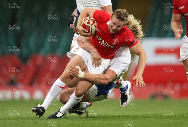 26.08.07 - Wales v France -  Wales' Dwayne Peel is tackled by France's Remy Martin 