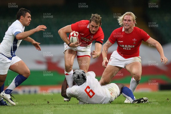 26.08.07 - Wales v France -  Wales' Jamie Robinson is tackloed by France's Serge Betsen 