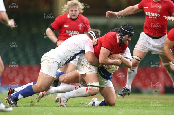 26.08.07 - Wales v France -  Wales' Jonathan Thomas is hauled down by the French defence 
