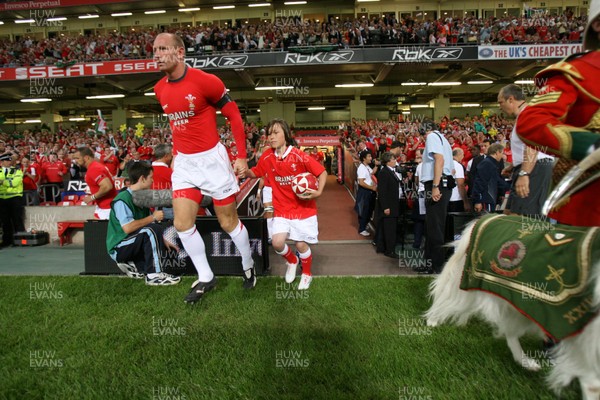 26.08.07  Wales v France... Gareth Thomas and mascot Jonathan David Rees lead out the team. 