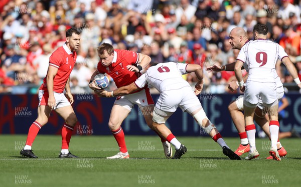 071023 - Wales v Georgia - Rugby World Cup, France 2023 - Pool C - Nick Tompkins of Wales is tackled by Mikheil Gachechiladze of Georgia 