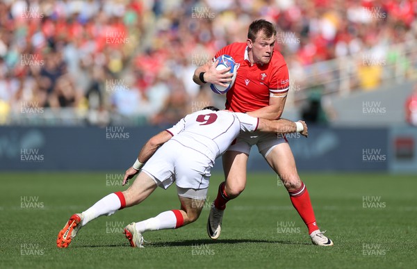 071023 - Wales v Georgia - Rugby World Cup, France 2023 - Pool C - Nick Tompkins of Wales is tackled by Vasil Lobzhanidze of Georgia 