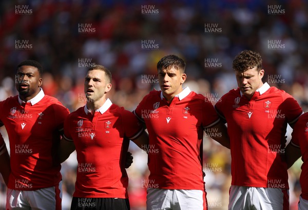 071023 - Wales v Georgia - Rugby World Cup, France 2023 - Pool C - Christ Tshiunza, George North, Dafydd Jenkins and Will Rowlands of Wales sing the anthem