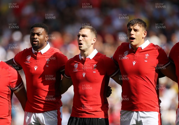 071023 - Wales v Georgia - Rugby World Cup, France 2023 - Pool C - Christ Tshiunza, George North and Dafydd Jenkins of Wales sing the anthem