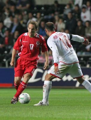 20.08.08 Wales vs. Georgia. Nationwide International Friendly. The Liberty Stadium, Swansea. David Vaughan runs at Zurab Menteshashvili. 