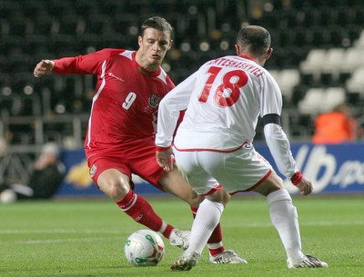 20.08.08 Wales vs. Georgia. Nationwide International Friendly. The Liberty Stadium, Swansea. Jason Koumas takes on  Zurab Khizanishvilli(18). 