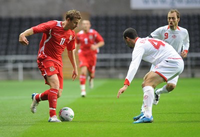 20.08.08 - International Football Friendly Wales v Georgia Wales' Paul Parry is challenged by Georgia's Aleksandre Kvakhadze 