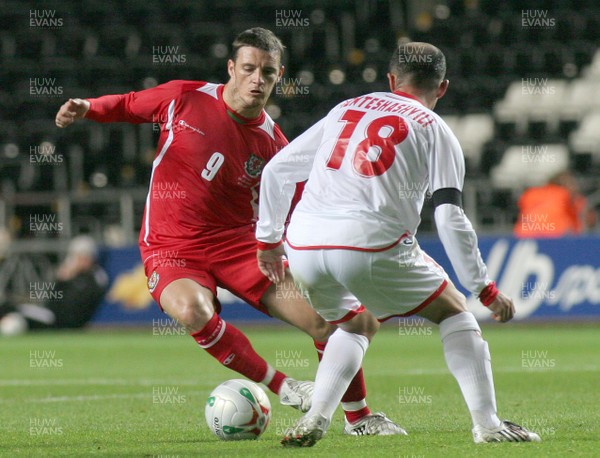 20.08.08 Wales vs. Georgia. Nationwide International Friendly. The Liberty Stadium, Swansea. Jason Koumas takes on  Zurab Khizanishvilli(18). 