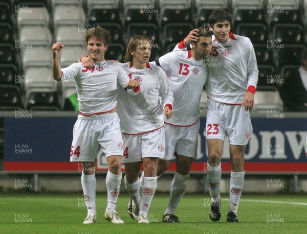 20.08.08 Wales vs. Georgia. Nationwide International Friendly. The Liberty Stadium, Swansea. Goal scorer Beka Gotsiridze(L) celebrates with team-mates Irakli Klimiashvile(24), Zurab Khizanishivili(13) & David Devdariani(24) following his injury time winner to edge out Wales 1-2. 