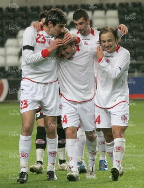 20.08.08 Wales vs. Georgia. Nationwide International Friendly. The Liberty Stadium, Swansea. Goal scorer Beka Gotsiridze(C) is congratulated by team-mates David Devdariani(23) & Irakli Klimiashvili(24) following his injury time winner to edge out Wales 1-2. 