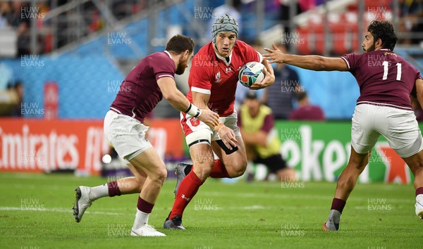 230919 - Wales v Georgia - Rugby World Cup 2019 - Pool D - Jonathan Davies of Wales is challenged by Vasil Lobzhanidze and Giorgi Kveseladze of Georgia