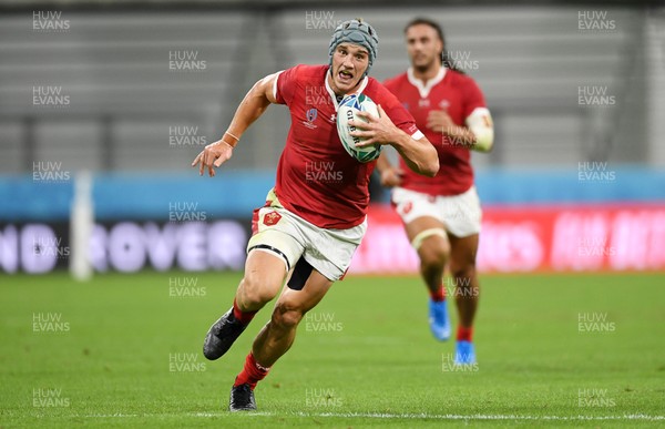 230919 - Wales v Georgia - Rugby World Cup 2019 - Pool D - Jonathan Davies of Wales races towards the corner