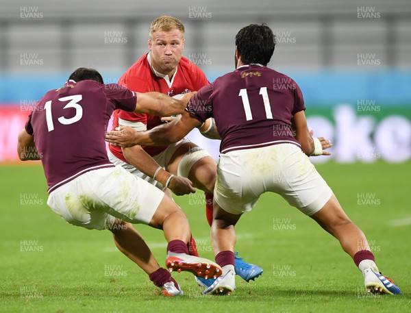 230919 - Wales v Georgia - Rugby World Cup 2019 - Pool D - Ross Moriarty of Wales is tackled by David Kacharava and Giorgi Kveseladze of Georgia