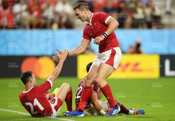 230919 - Wales v Georgia - Rugby World Cup 2019 - Pool D - Tomos Williams is congratulated after scoring a try by George North of Wales