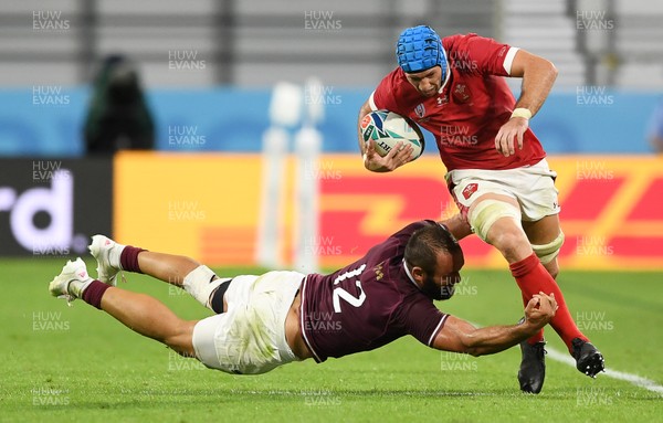 230919 - Wales v Georgia - Rugby World Cup 2019 - Pool D - Justin Tipuric of Wales is tackled into touch by Tamaz Mchedlidze of Georgia