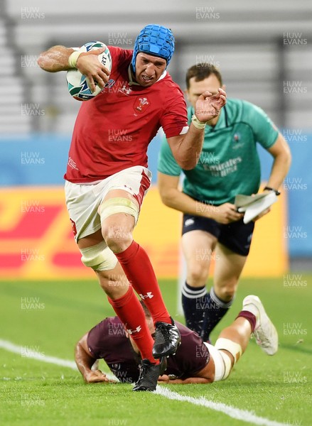 230919 - Wales v Georgia - Rugby World Cup 2019 - Pool D - Justin Tipuric of Wales is tackled into touch by Tamaz Mchedlidze of Georgia