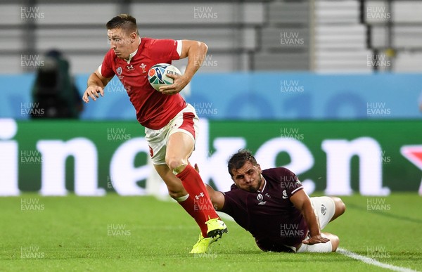 230919 - Wales v Georgia - Rugby World Cup 2019 - Pool D - Josh Adams of Wales is tackled by Guram Gogichashvili of Georgia