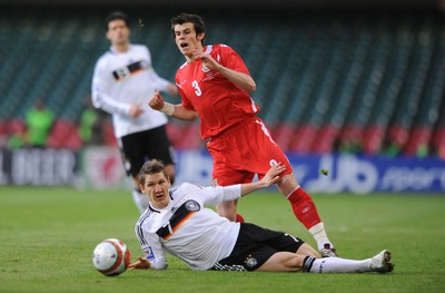 01.04.09 - Wales v Germany - 2010 FIFA World Cup Qualifying Group 4 - Wales' Gareth Bale is tackled by Germany's Bastian Schweinsteiger 