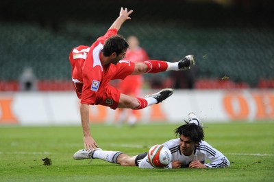 01.04.09 - Wales v Germany - 2010 FIFA World Cup Qualifying Group 4 - Wales' Joe Ledley is challenged by Germany's Serdar Tasci. 