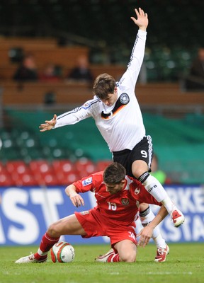 01.04.09 - Wales v Germany - 2010 FIFA World Cup Qualifying Group 4 - Wales' Ched Evans is tackled by Germany's Patrick Helmes. 