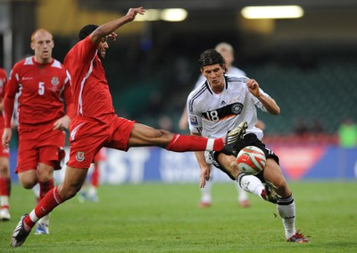 01.04.09 - Wales v Germany - 2010 FIFA World Cup Qualifying Group 4 - Germany's Mario Gomez is tackled by Ashley Williams. 