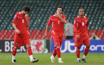 01.04.09 - Wales v Germany - 2010 FIFA World Cup Qualifying Group 4 - Wales' Joe Ledley, Simon Davies and Rob Earnshaw look dejected at the end of the game. 