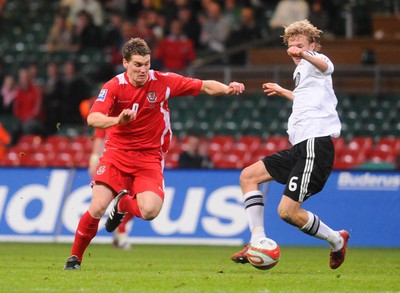 01.04.09 - Wales v Germany - World Cup 2010 - Qualifying Group 4 Wales' Sam Vokes is tackled by Germany's Simon Rolfes 