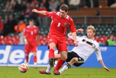 01.04.09 - Wales v Germany - World Cup 2010 - Qualifying Group 4 Wales' Sam Vokes is tackled by Germany's Simon Rolfes 