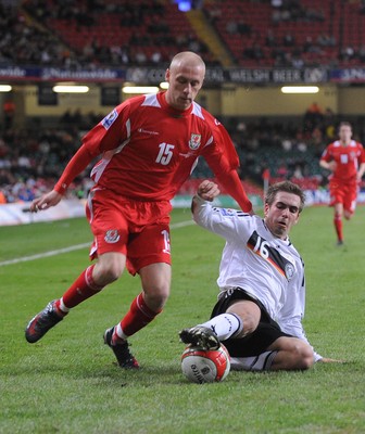 01.04.09 - Wales v Germany - World Cup 2010 - Qualifying Group 4 Wales' David Cotterill is tackled by Germany's Philipp Lahm 