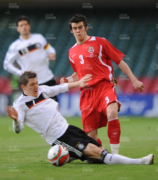 01.04.09 - Wales v Germany - 2010 FIFA World Cup Qualifying Group 4 - Wales' Gareth Bale is tackled by Germany's Bastian Schweinsteiger 
