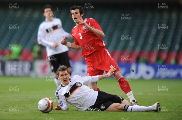 01.04.09 - Wales v Germany - 2010 FIFA World Cup Qualifying Group 4 - Wales' Gareth Bale is tackled by Germany's Bastian Schweinsteiger 