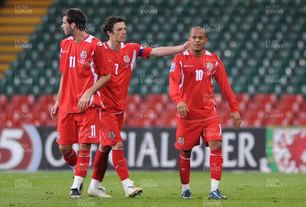 01.04.09 - Wales v Germany - 2010 FIFA World Cup Qualifying Group 4 - Wales' Joe Ledley, Simon Davies and Rob Earnshaw look dejected at the end of the game. 