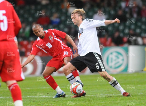 01.04.09 - Wales v Germany - World Cup 2010 - Qualifying Group 4 Germany's Simon Rolfes is tackled by Wales' Rob Earnshaw 