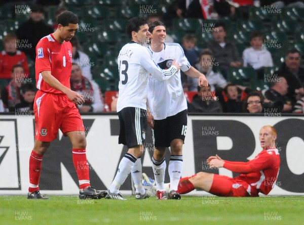 01.04.09 - Wales v Germany - World Cup 2010 - Qualifying Group 4 Michael Ballack and Mario Gomez celebrate Germany's second goal (Ashley Williams own goal). Wales' Lewin Nyatanga and James Collins look on. 
