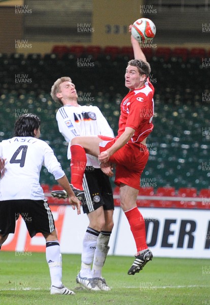 01.04.09 - Wales v Germany - World Cup 2010 - Qualifying Group 4 Wales' Sam Vokes ad Germany's Per Mertesacker compete 