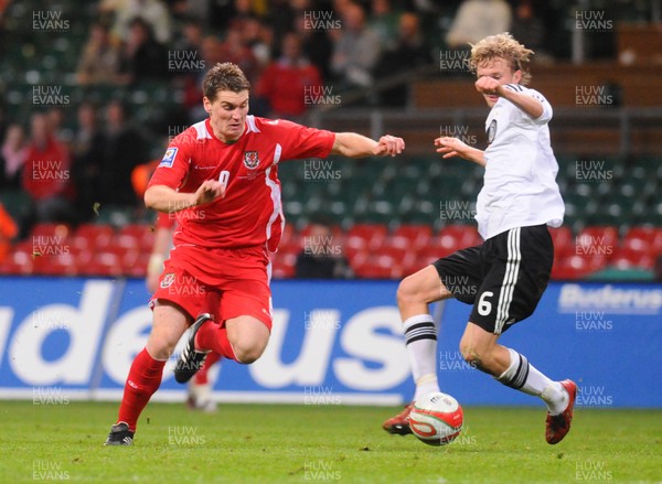 01.04.09 - Wales v Germany - World Cup 2010 - Qualifying Group 4 Wales' Sam Vokes is tackled by Germany's Simon Rolfes 