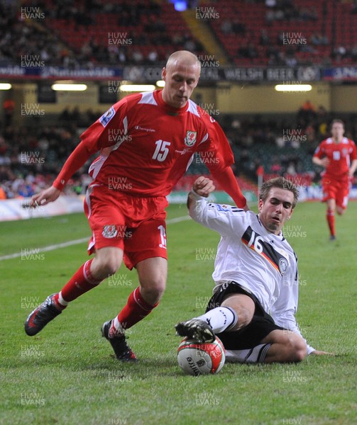 01.04.09 - Wales v Germany - World Cup 2010 - Qualifying Group 4 Wales' David Cotterill is tackled by Germany's Philipp Lahm 