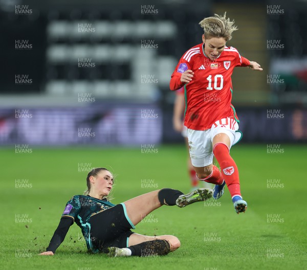 051223  - Wales v Germany, UEFA Women’s Nations League - Jule Brand of Germany clears the ball as Jess Fishlock of Wales closes in