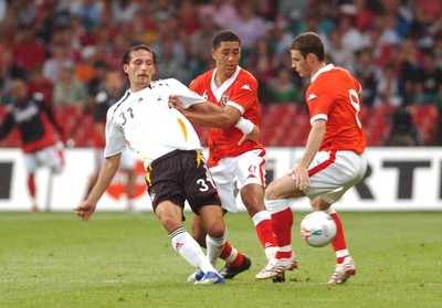 08.09.07 - Euro 2008 Qualifying, Group D Wales v Gemany Germany's Kevin Kuranyi is challenged by Wales' Lewin Nyatanga and Jason Koumas 
