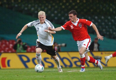 08.09.07 - Euro 2008 Qualifying, Group D Wales v Gemany Germany's Bastian Schweinsteiger is challenged by Wales' Jason Koumas 