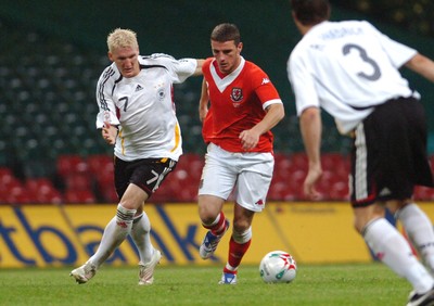 08.09.07 - Euro 2008 Qualifying, Group D Wales v Gemany Wales' Jason Koumas is challenged by Germany's Bastian Schweinsteiger 