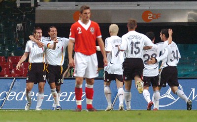 08.09.07 - Euro 2008 Qualifying, Group D Wales v Gemany Wales' Sam Ricketts dejected as german players celebrate their second goal 