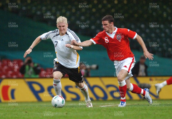 08.09.07 - Euro 2008 Qualifying, Group D Wales v Gemany Germany's Bastian Schweinsteiger is challenged by Wales' Jason Koumas 