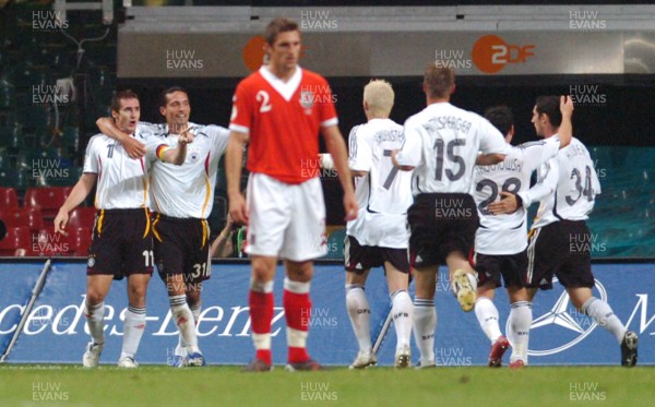 08.09.07 - Euro 2008 Qualifying, Group D Wales v Gemany Wales' Sam Ricketts dejected as german players celebrate their second goal 
