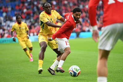 020626 - Wales v Ghana - International Friendly - Jay Dasilva of Wales is challenged by Prince Kwabena Adu of Ghana