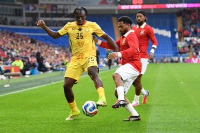 020626 - Wales v Ghana - International Friendly - Prince Kwabena Adu of Ghana is challenged by Jay Dasilva go Wales