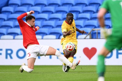 020626 - Wales v Ghana - International Friendly - Kamaldeen Sulemana of Ghana has his shot blocked by Neco Williams of Wales